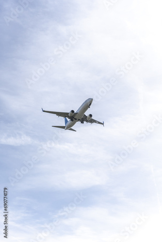 A plane approaching the landing strip of an airport