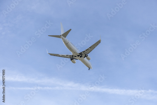the approach of a jet plane flying at low altitude