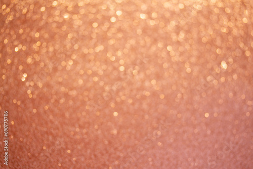 Christmas holiday glittering defocused Peach Fuzz background with bokeh lights