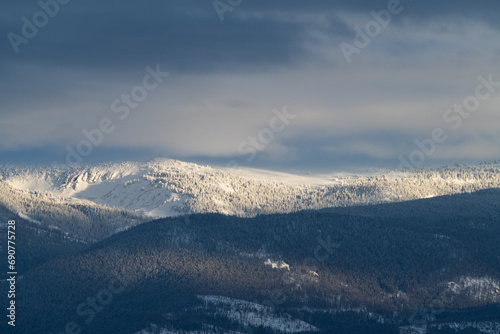 Mid Winter snow storm on the Indian Peaks Mountain Range, provides a dramatic mysterious backdrop above the Fraser Valley. 