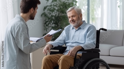 A Conversation Between a Man in a Wheelchair and a Man in a Blue Shirt