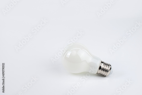 Light Bulb with Light Reflections on Bright Surface