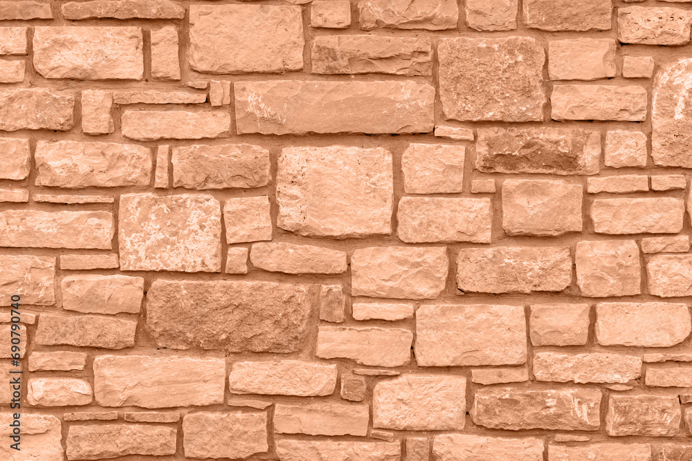 Color of the year 2024: Peach fuzz. Plain stone wall. Color of the year 2024: Peach fuzz. Plain stone wall.