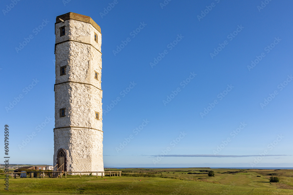 Obraz premium Old Flamborough Lighthouse, built in 1674, the oldest of the two historic lighthouses set on the high chalk cliffs of Flamborough Head in Yorkshire