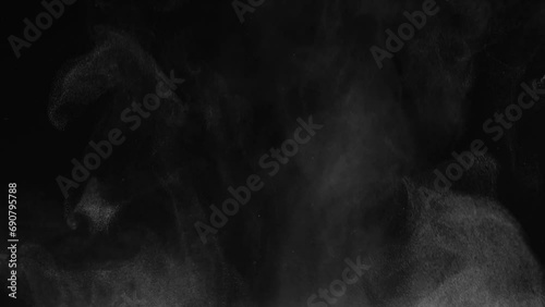 White steam from hot food or drink. White steam on a black background rises to the top. Cooking a hot meal in the kitchen. photo