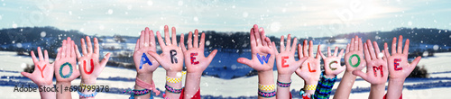 Children Hands Building Word You Are Welcome, Winter Background