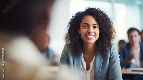 A Diversity and Inclusion Manager in a meeting room, strategizing on inclusivity initiatives, Diversity and inclusion manager, blurred background, with copy space