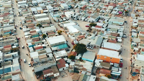 Aerial drone, township buildings and shanty town settlement for house, development or informal urban expansion. Favela home, property or landscape on grid, street or growth for population at location