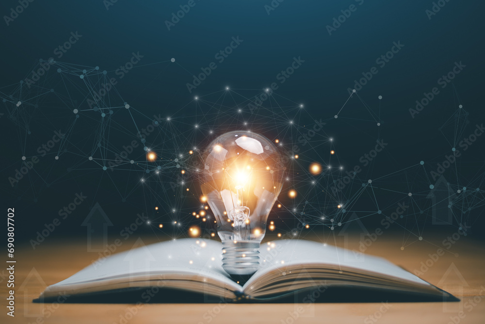Glowing light bulb on a book, Inspiring from read concept, Educational knowledge and business education ideas, Innovations, self-learning, knowledge and searching for new ideas. Thinking for new idea. - obrazy, fototapety, plakaty 