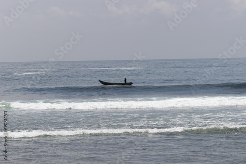 fishermen's canoes looking for fish photo