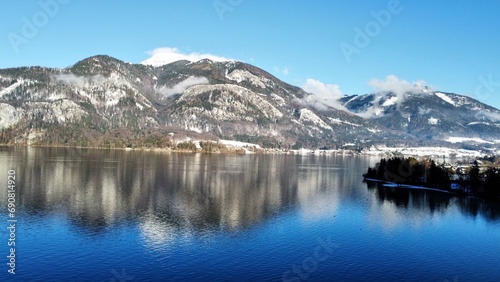 Beautiful view of the mountains and lake. Against the background of blue clouds. Winter