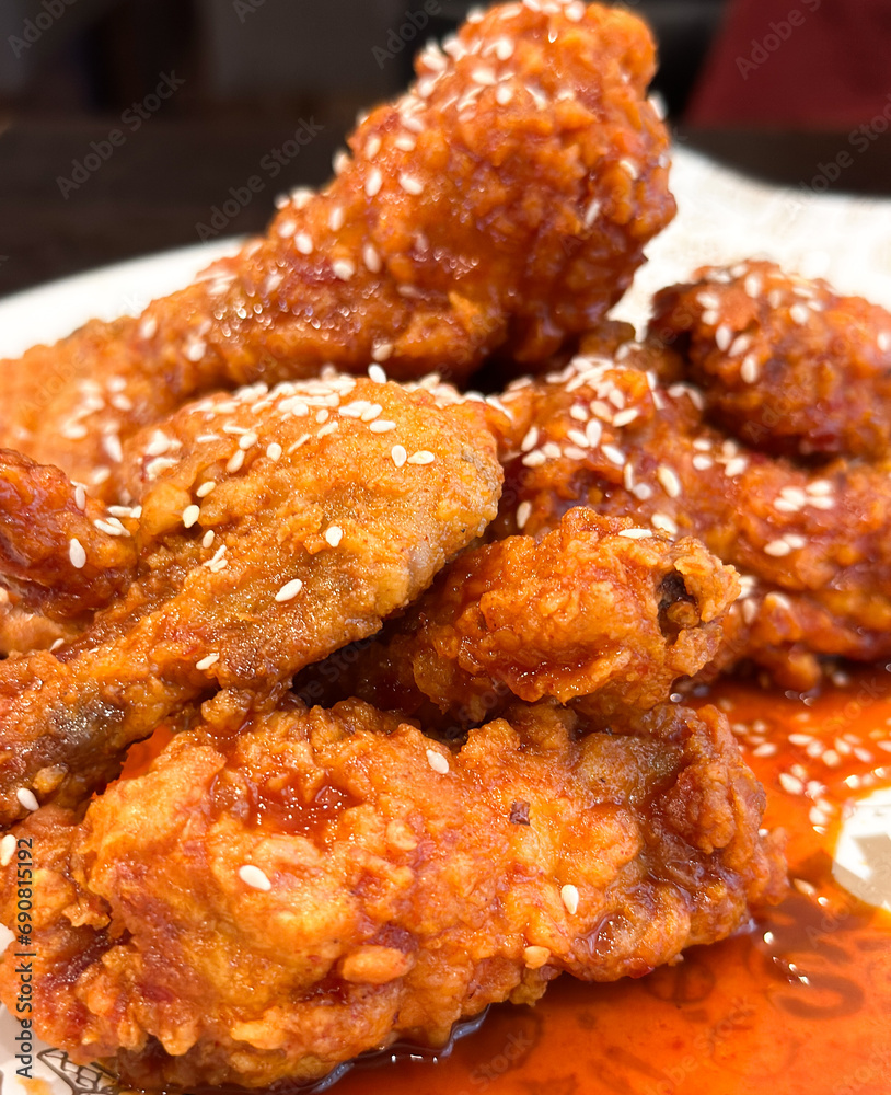 Close up of crispy fried chicken with sweet chilli sauce Close up of crispy fried chicken with sweet chilli sauce