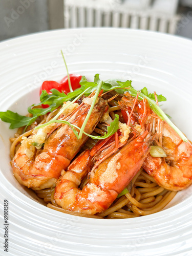 Close up of asian style prawn spaghetti with soy sauce and garlic © taffpixture