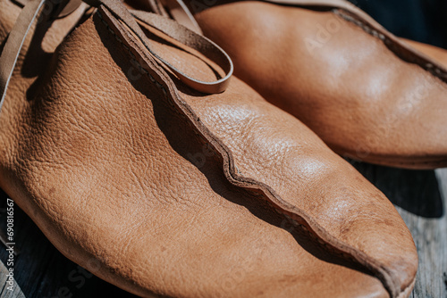 Brown leather shoe, classic and elegant design, perfect for formal occasions.