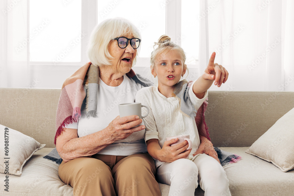 Child couch granddaughter girl grandmother Child couch granddaughter girl grandmother