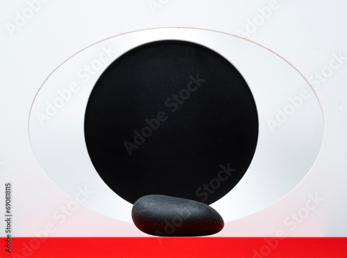 black stone on a red white background for product presentation