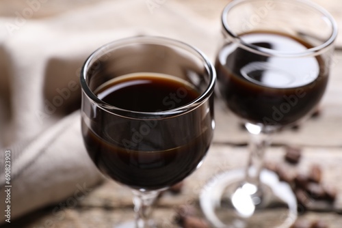 Glasses of coffee liqueur on table, closeup