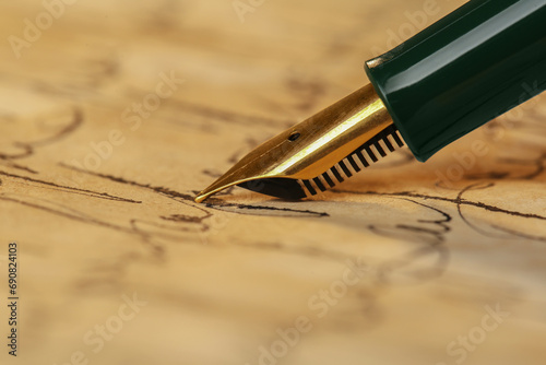 Woman writing letter with fountain pen, closeup photo