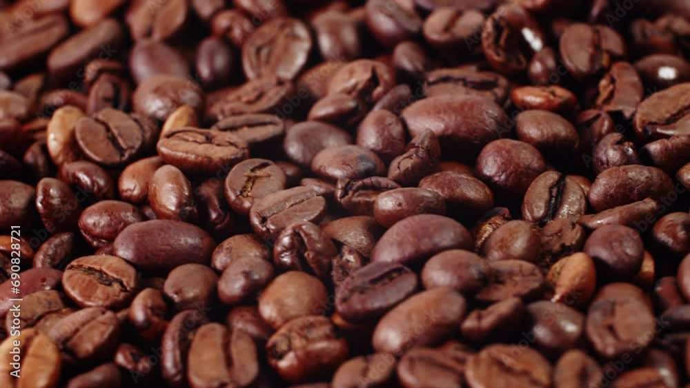 Close up of roasted brown coffee beans rotating Background roasted coffee beans Close up of roasted brown coffee beans rotating Background roasted coffee beans