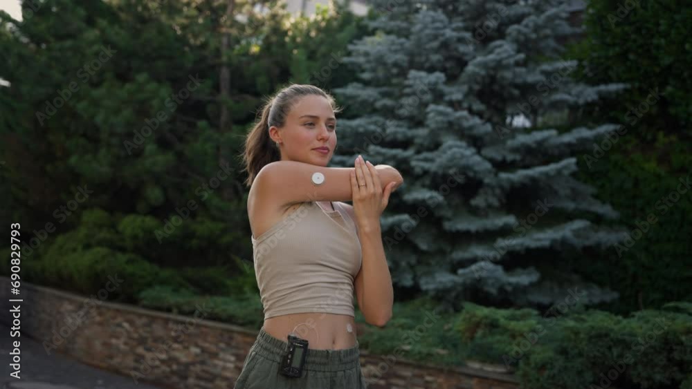 Beautiful diabetic woman preparing for outdoor workout in the city.