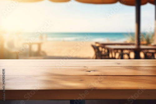 Sunlit sandy beach empty table close-up, the interior of a beachside cafe with a blurred seascape in the background, ready for a relaxed spring break scene.