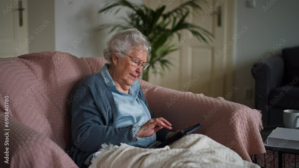 Video of happy senior woman sitting at home and calling. Video of happy senior woman sitting at home and calling.