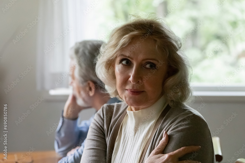 Marital split. Unhappy aged wife turn back to husband after quarrel demonstrate indifference suffer of crisis in relations. Offended senior female feel angry on stubborn spouse unwilling to forgive Marital split. Unhappy aged wife turn back to husband after quarrel demonstrate indifference suffer of crisis in relations. Offended senior female feel angry on stubborn spouse unwilling to forgive