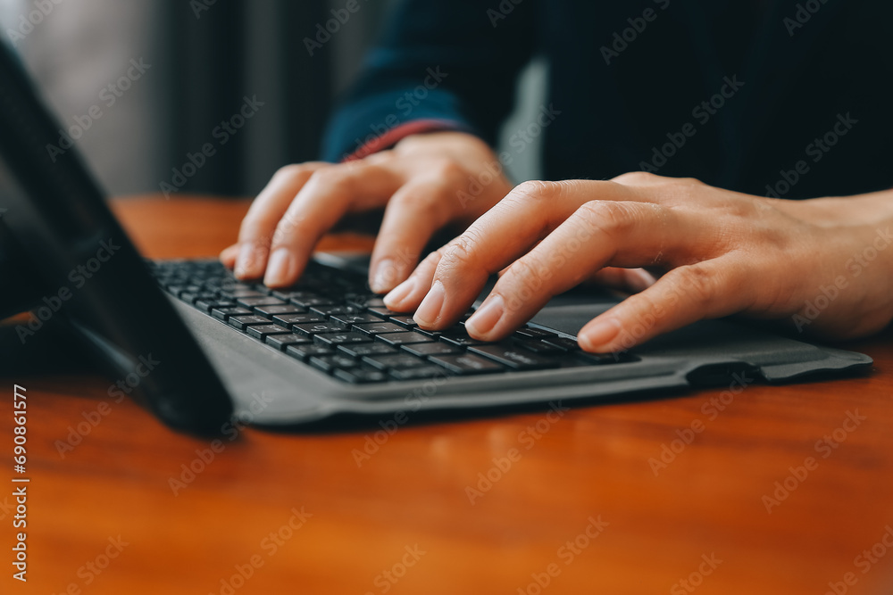 Asian Businesswoman Using laptop computer and working at office with calculator document on desk, doing planning analyzing the financial report, business plan investment, finance analysis concept. Asian Businesswoman Using laptop computer and working at office with calculator document on desk, doing planning analyzing the financial report, business plan investment, finance analysis concept.