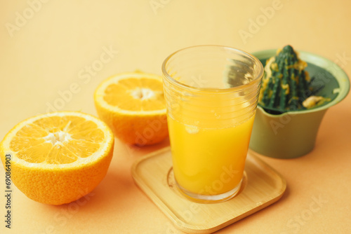 squeezing oranges into orange juice,