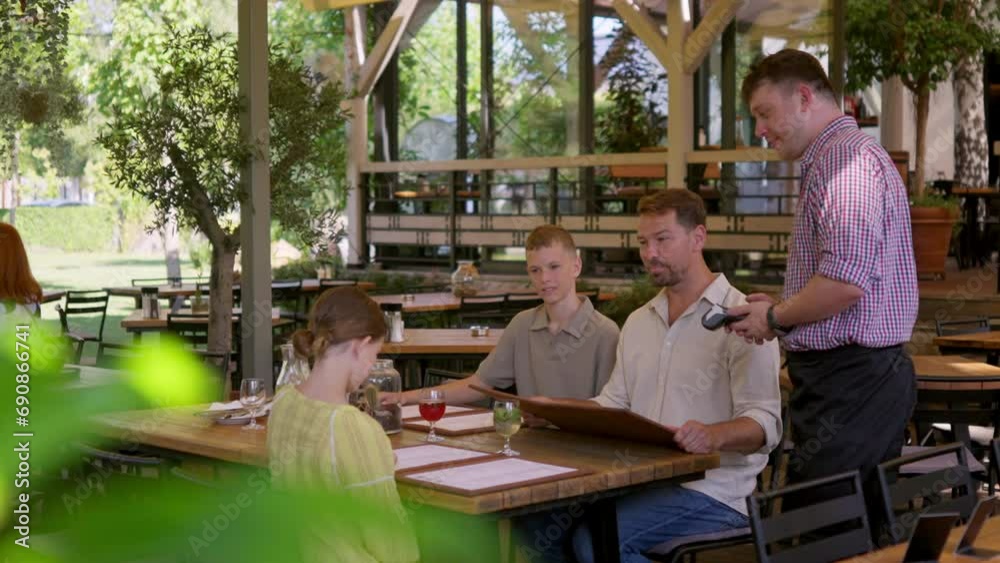 Man paying for lunch in a restaurant by card. Man paying for lunch in a restaurant by card.