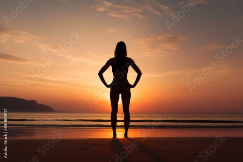 Photo of a fitness instructor on a beach at sunrise. Generative AI