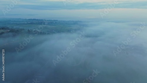 Wallpaper Mural Aerial landscape over fog-shrouded countryside in the morning. Torontodigital.ca