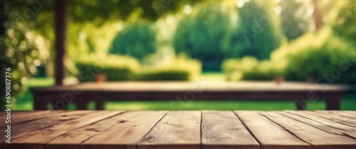 Wooden table in a garden with a blurred background.