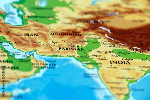 world map or atlas of asian continent, india, iran, pakistan, afghanistan, tehran, kabul, islamabad countries in close up photo