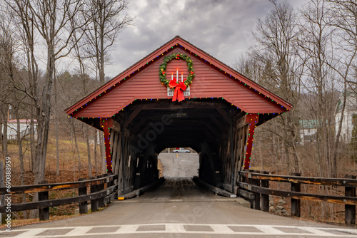 Historic timber one lane covered bridge in the Town of Newfield  Tompkins County NY with holiday lights. 