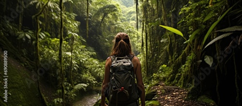 Backpacker girl explores enchanting, wild Costa Rican rainforest.