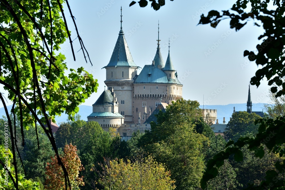 View from behind the trees of the old walls castle Bojnice Slovakia