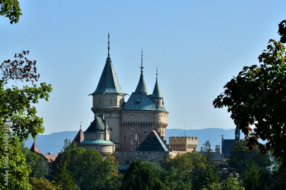 View from behind the trees of the old walls castle Bojnice Slovakia
