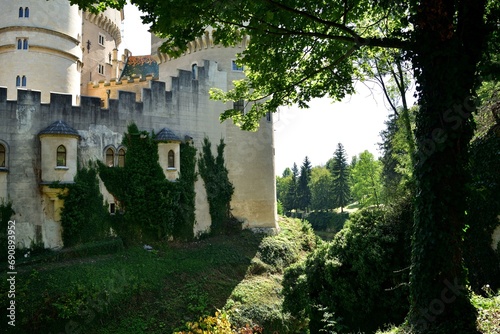 The old walls of the historic castle surrounded by natural water