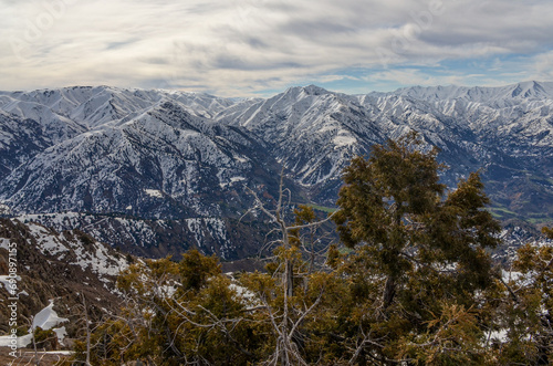 scenic view of Nurekata valley and Chimgan mountains in early spring from Amirsoy ski resort (Tashkent region, Uzbekistan)