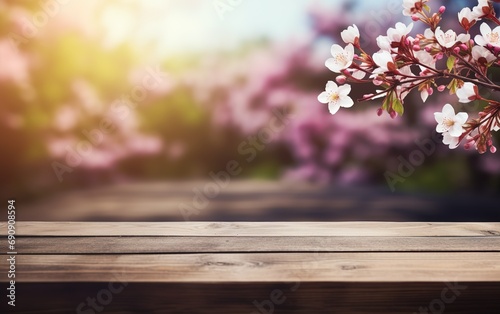 Beautiful blooming spring flowers branches background. Wooden table, display with copy space for product presentation.