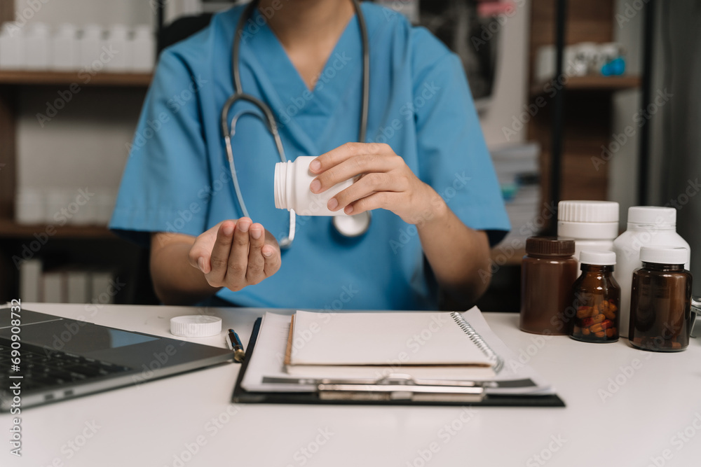 Pharmacists or doctors study information about tablets in the operating room in the evening. Pharmacists or doctors study information about tablets in the operating room in the evening.