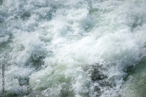 Severe water with turbulence flow and splashing due to heavy weather condition. Nature environmental. © Nattawit