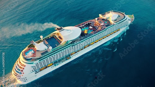 Cruise ship sailing across The Mediterranean sea - Aerial footage. luxury cruise in the ocean sea concept tourism travel on holiday take a vacation time on summer.  photo