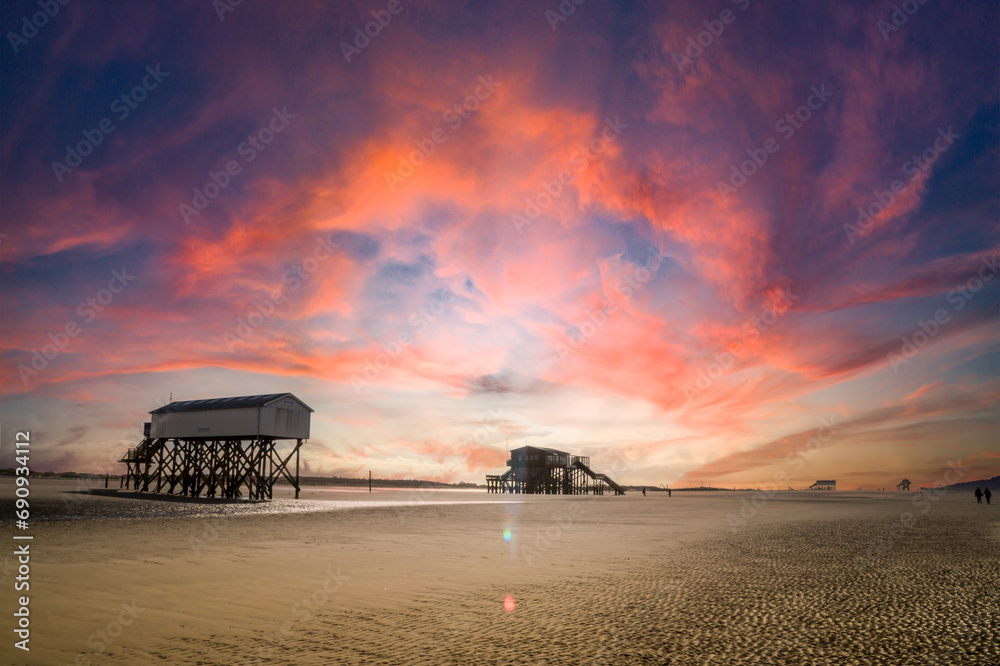 Sunset on the beach of Sankt Peter-Ording in Germany Sunset on the beach of Sankt Peter-Ording in Germany