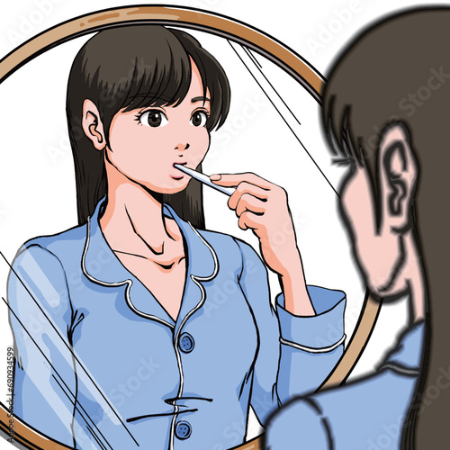洗面台前に立ち歯磨きするパジャマ姿の若い女性