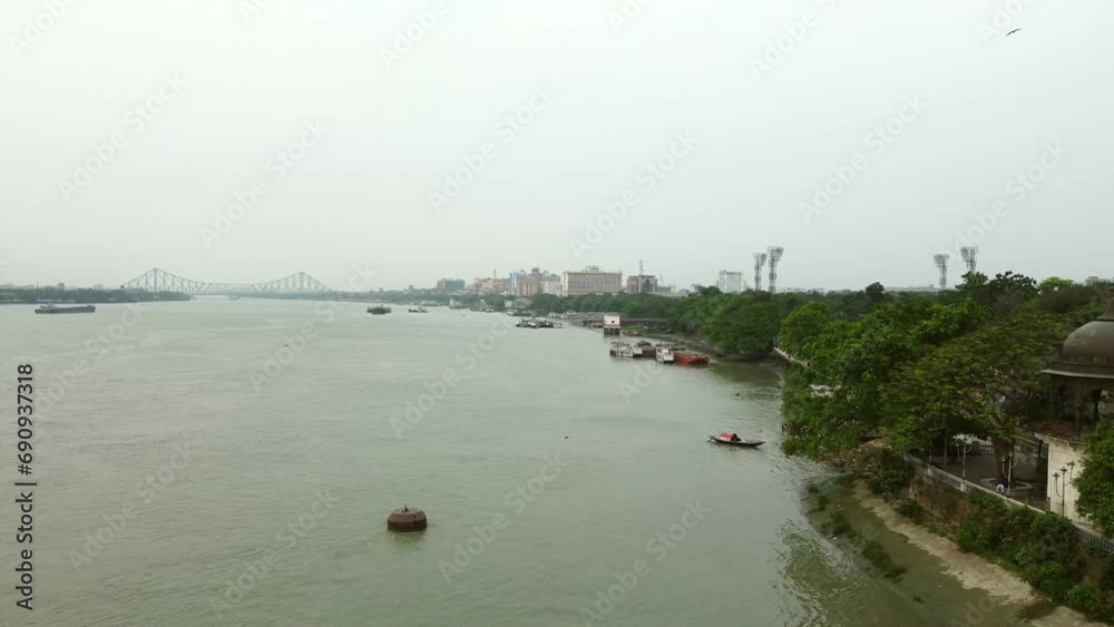   the Hooghly River And Howrah Bridge over the holy river Ganges communicating in between Howrah and Calcutta. British period Bridge.