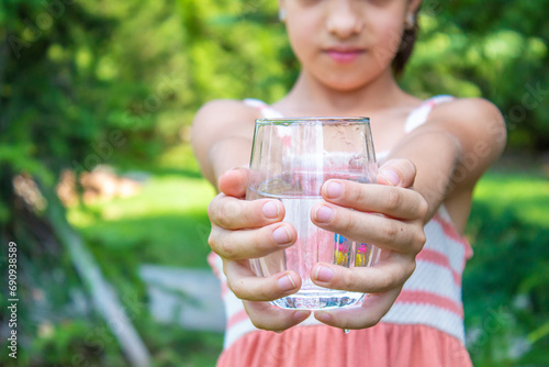 The child drinks water. food selective focus. children