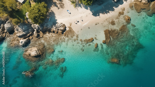 Top view of a seashore, beach and ocean from above as if the picture was taken by a drone