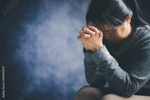 Christian life crisis prayer to god. Woman worship for god blessing to wishing have a better life. woman hands praying to god with the bible. begging for forgiveness and believe in goodness.